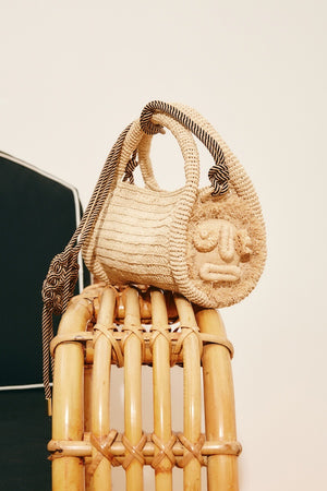 SUNLIT RAFFIA MINI BARREL BAG