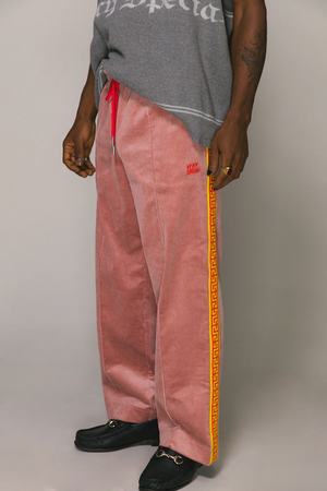 DUSTY PINK CORD GEO TRACK PANTS